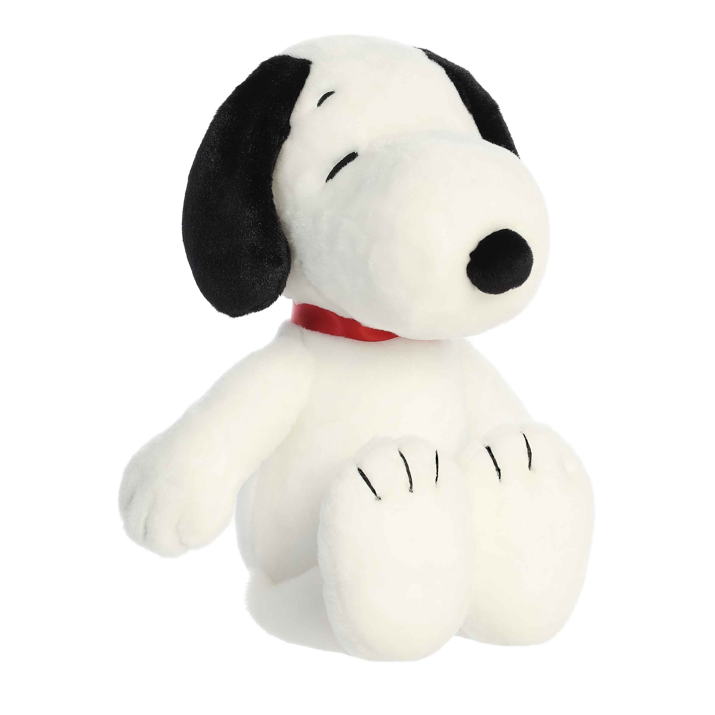 Oversized Floppy Snoopy plush from Peanuts, featuring a large, cuddly white body with a red collar.