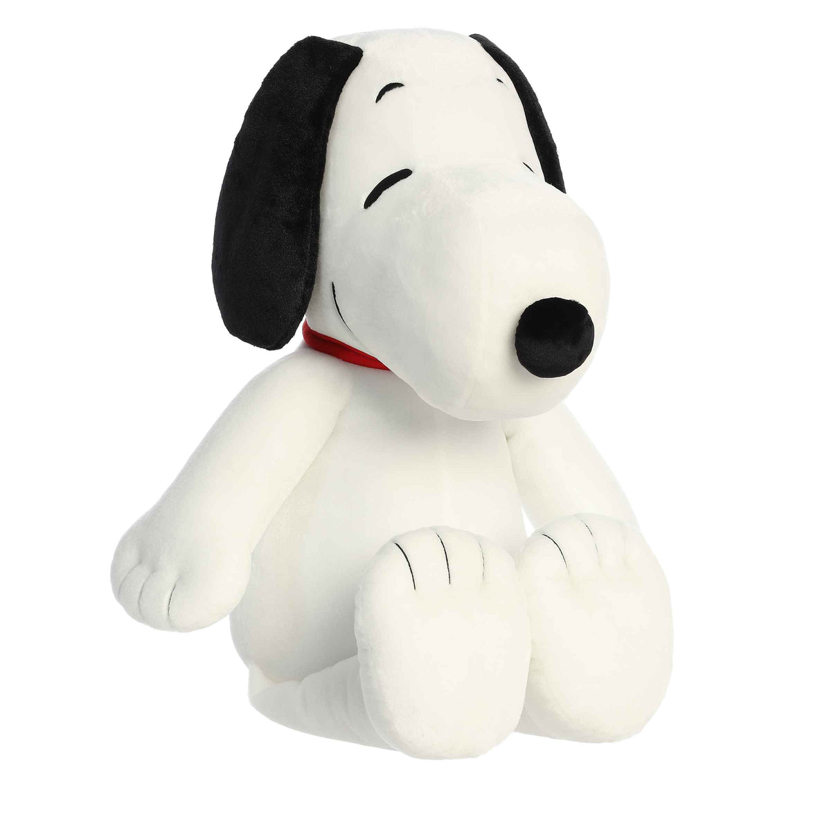 Extra-large Jumbo Floppy Snoopy plush from Peanuts, featuring a soft white body, distinctive black ears, and a red collar.