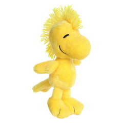 Plush toy of Floppy Woodstock from Peanuts, featuring a soft yellow body and a distinctive hair tuft