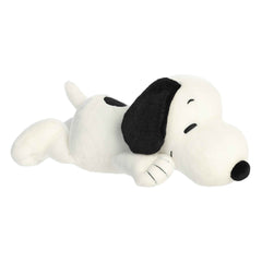 Plush toy of Snuggle Snoopy from Peanuts, in a lying down pose, featuring soft white fur, big black ears