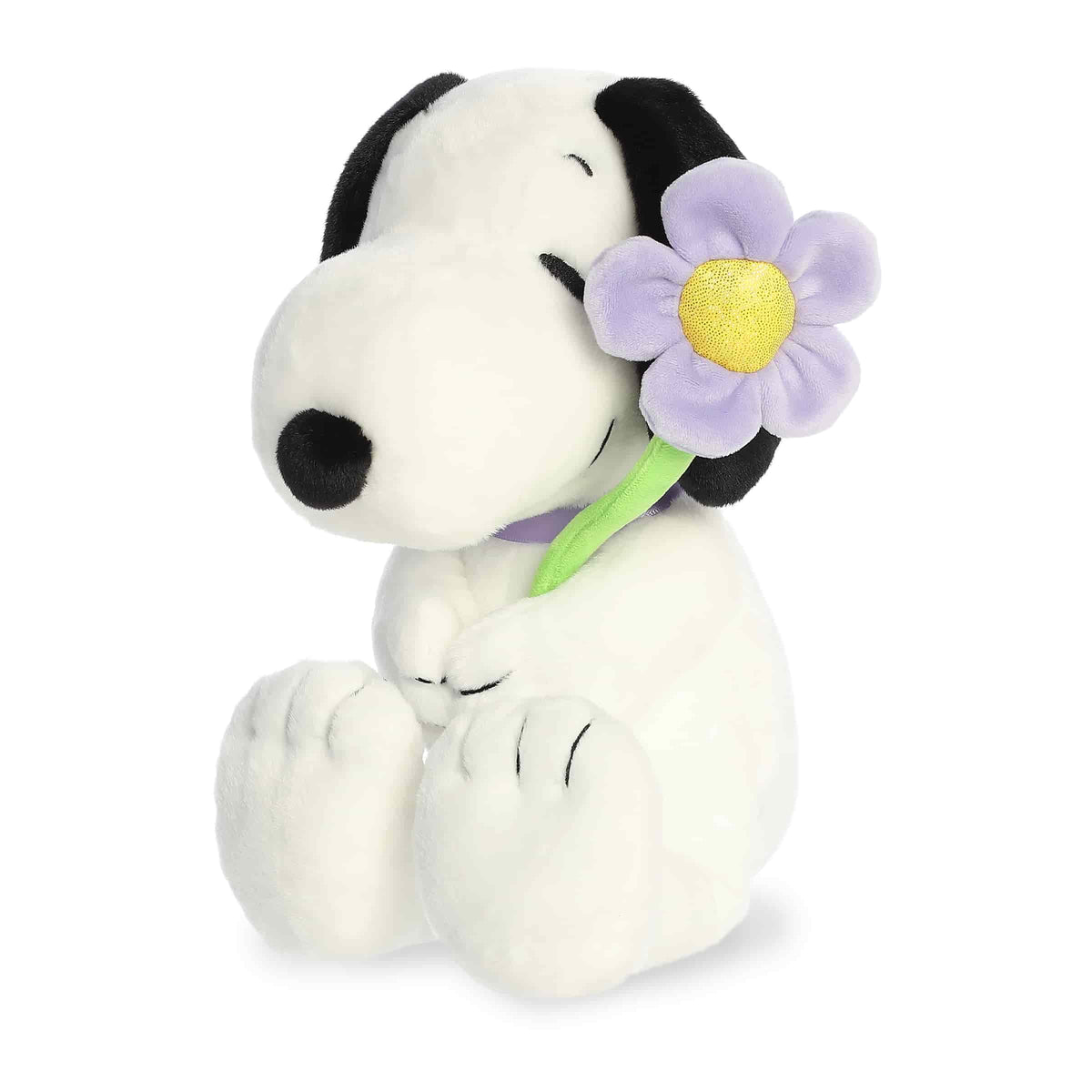Snoopy plush holding purple flower with soft fabric body, floppy ears, and friendly expression