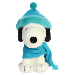 Snoopy plush wearing a bright winter scarf and matching hat