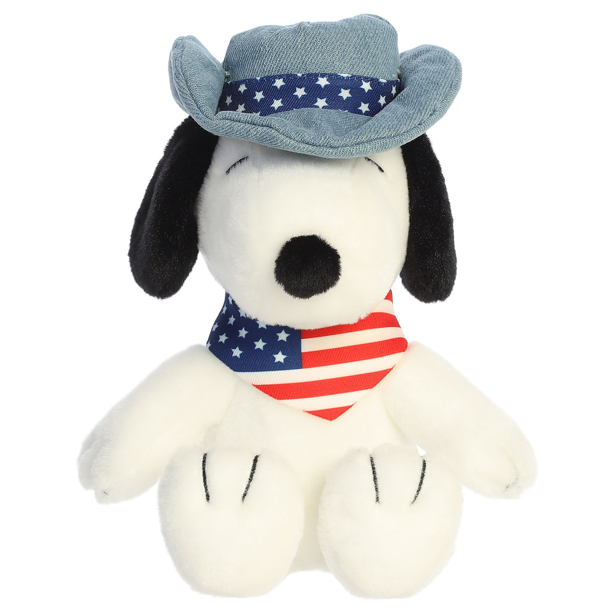 A Snoopy plush toy from Aurora with a blue hat and an American flag bandana.