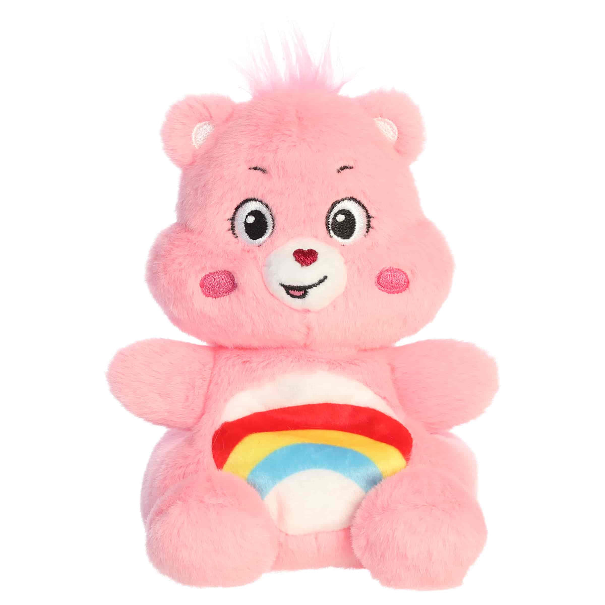 Cheer Bear Palm Pals plush with soft pink fur, sweet smile, round ears, and colorful rainbow belly badge