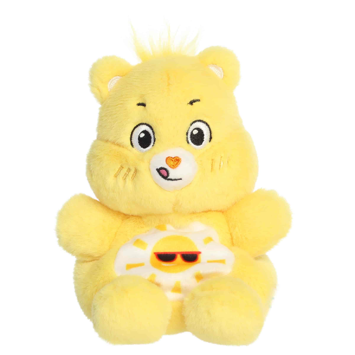 Funshine Bear Palm Pals plush with soft yellow fur, cheerful smile, round ears, and smiling sun belly badge