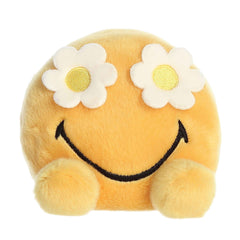 Plush toy from the SmileyWorld collection, featuring a bright yellow face with a smile and white daisy flowers over the eyes