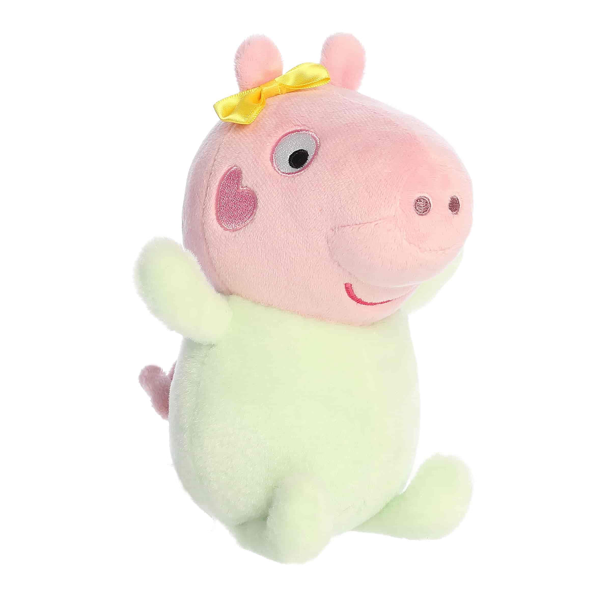 A Baby Evie plush wearing a pastel green outfit with a pink snout from Aurora’s Peppa Pig Collection.