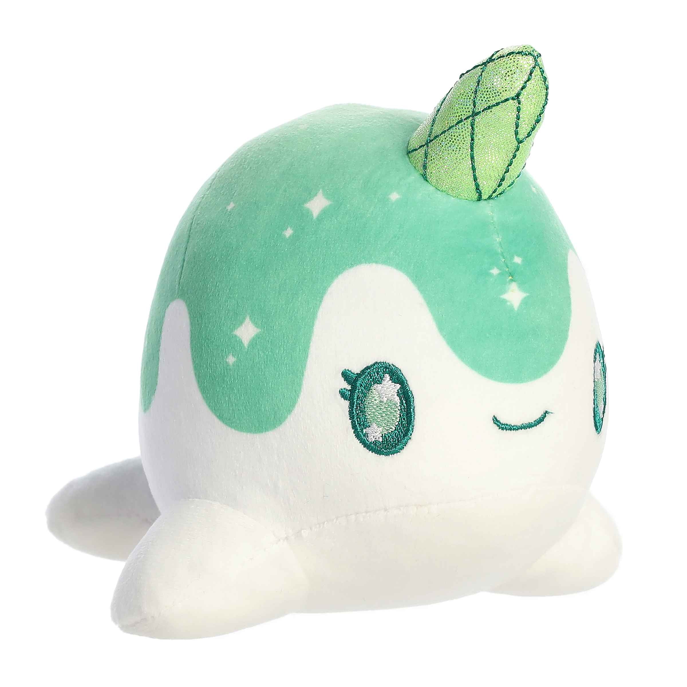 Plush toy of Nomwhal Emerald from the Tasty Peach collection with a green body, star accents, and a sparkling emerald horn.