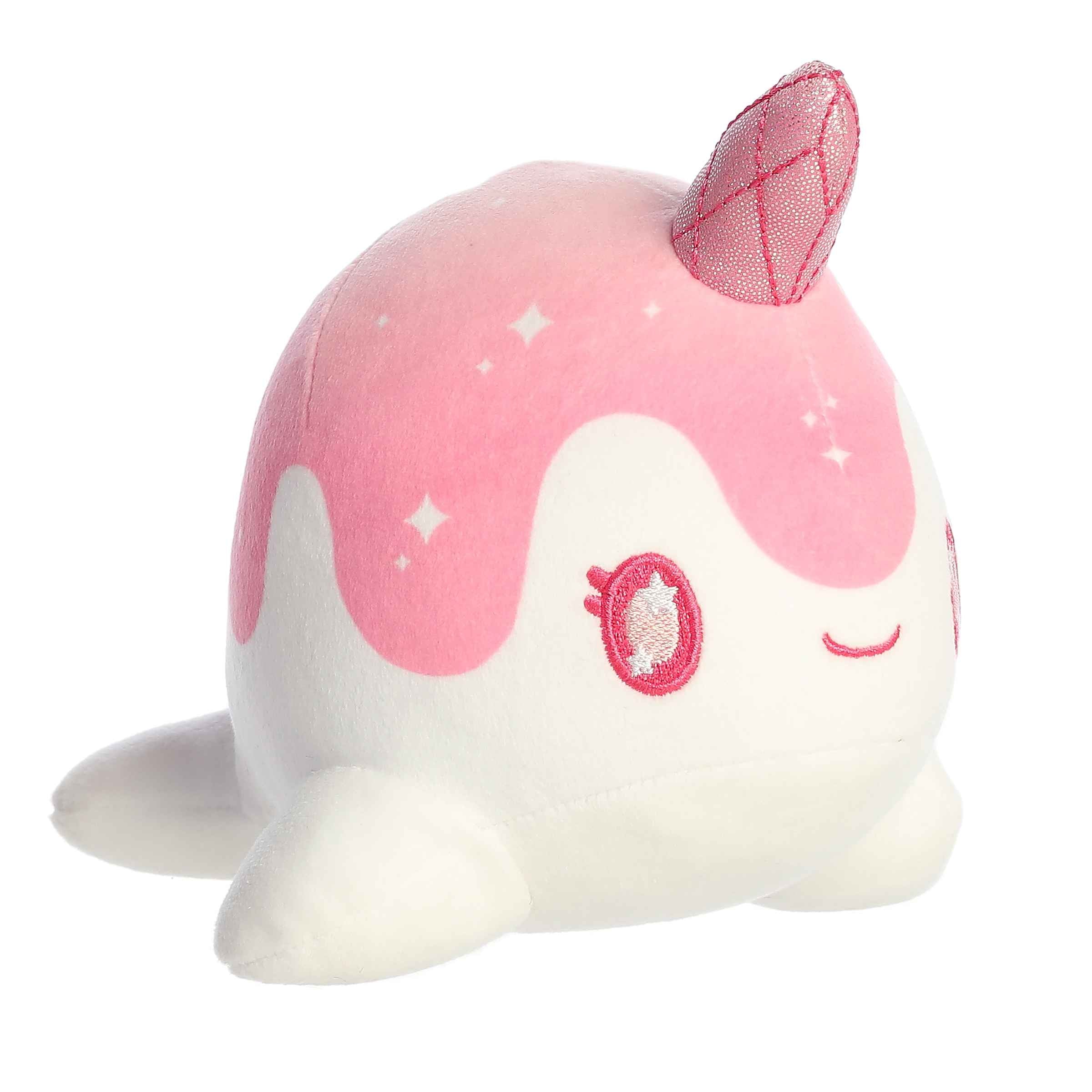 Plush of Crystal Nomwhal from the Tasty Peach collection with a pink body, star accents, and a shimmering rose quartz horn