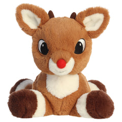 A Rudolph plush toy from Aurora with a red nose, sweet expression, and a laying pose.