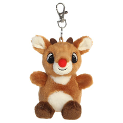 A Rudolph plush clip-on from Aurora with a brown body, red nose, tiny antlers, and embroidered features.