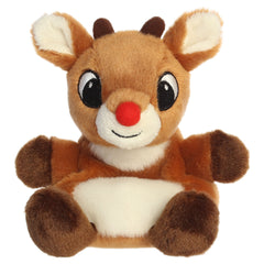 A Rudolph Palm Pal plush toy from Aurora with a brown body, red nose, tiny antlers, and embroidered features.