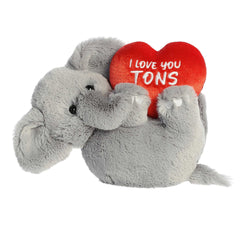 Grey plush elephant with a heart, perfect for expressing immense love and care.