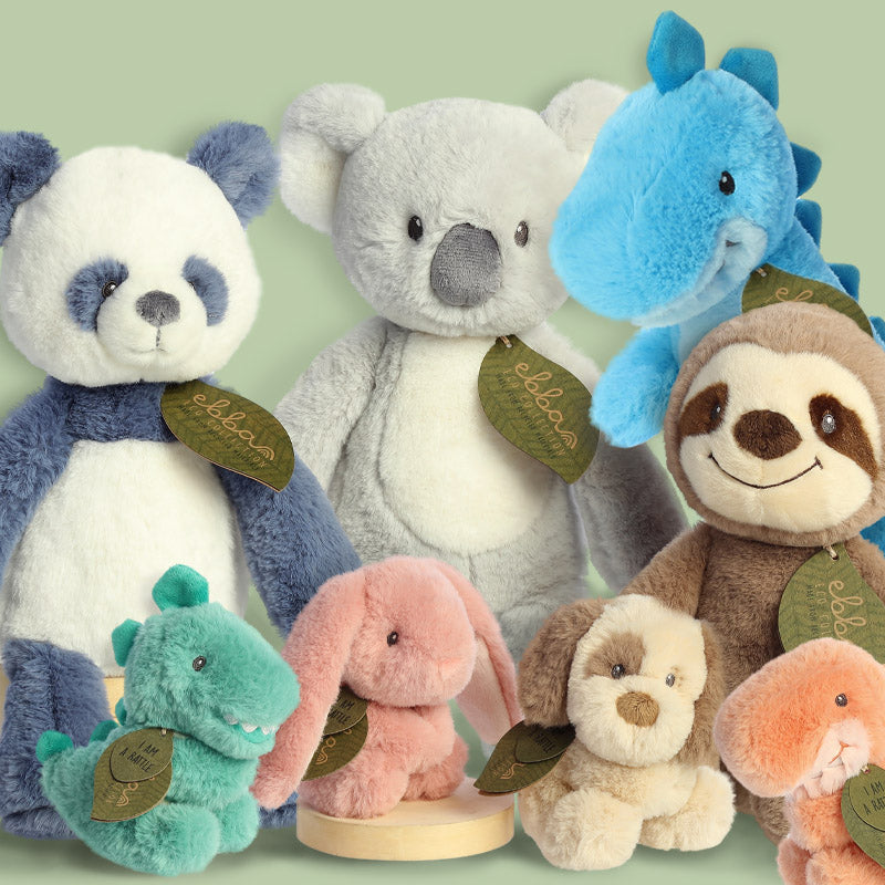 Stuffed animals in the eco ebba plush baby toy collection, with a panda plush, koala plush, sloth plush, and dino plush.