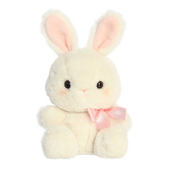 A plush bunny in a fluffy off-white colored fur coat and an adorable pink bow around its neck