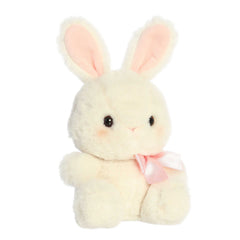 A plush bunny in a fluffy light grey colored fur coat and an adorable pink bow around its neck