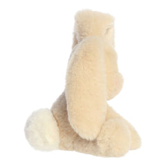 A plush bunny with a hazelnut cream colored coat of fur with one ear up and one ear down