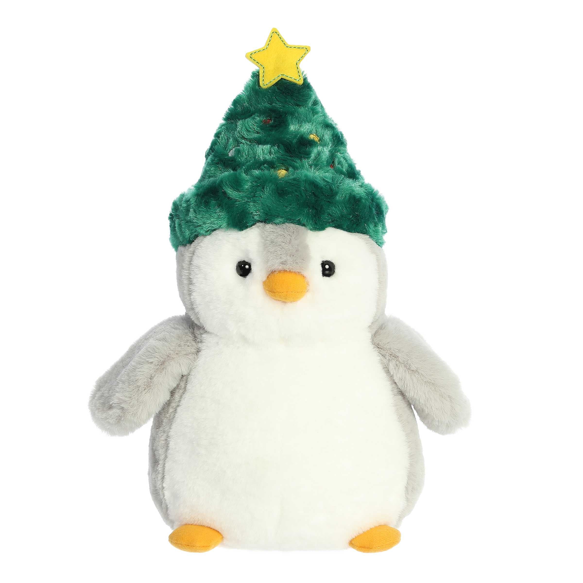 Gray back and white front stubby penguin stuffed animal wearing a green Christmas tree hat with a yellow star on top