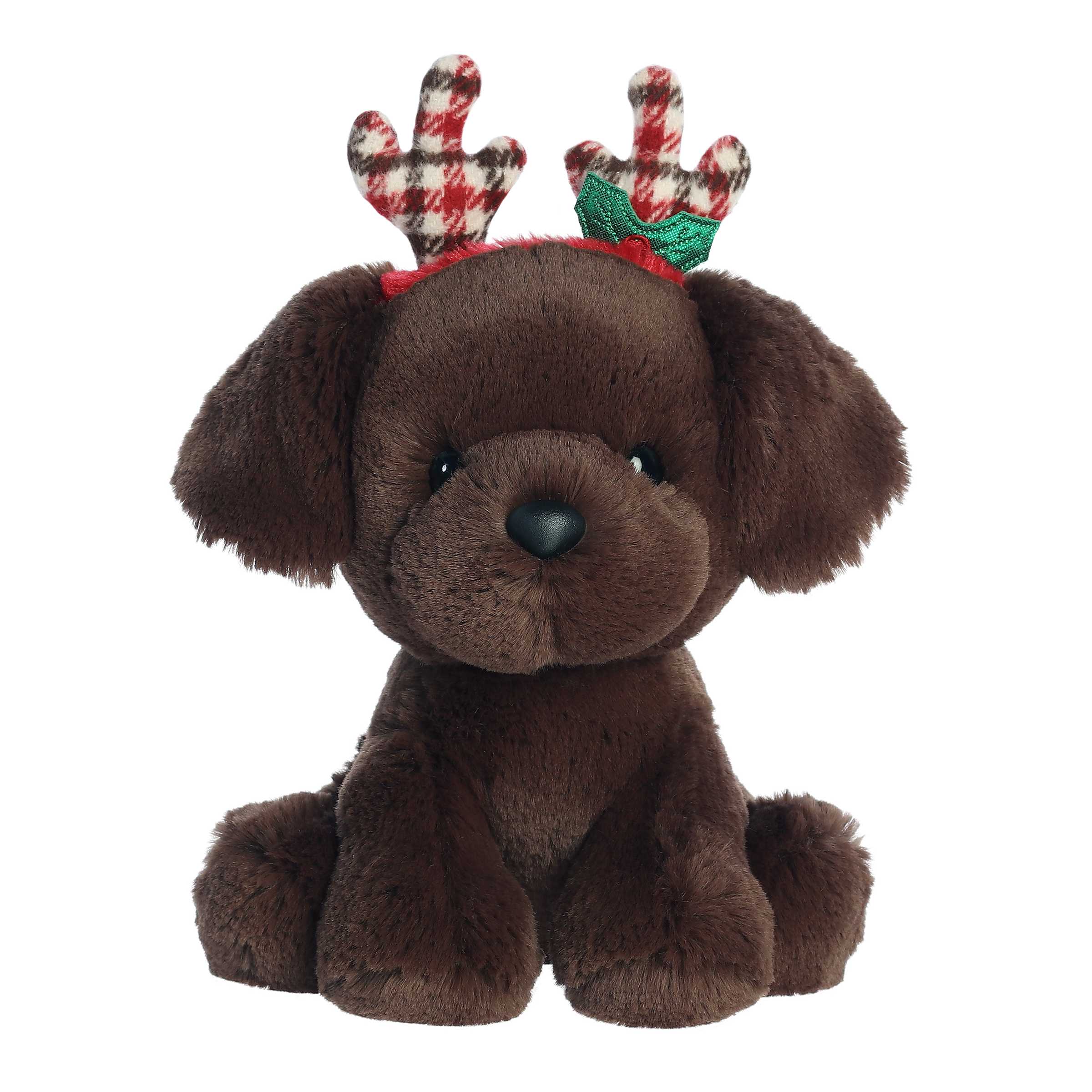 Adorable chocolate lab puppy in a sitting position wearing plaid colored holiday antlers