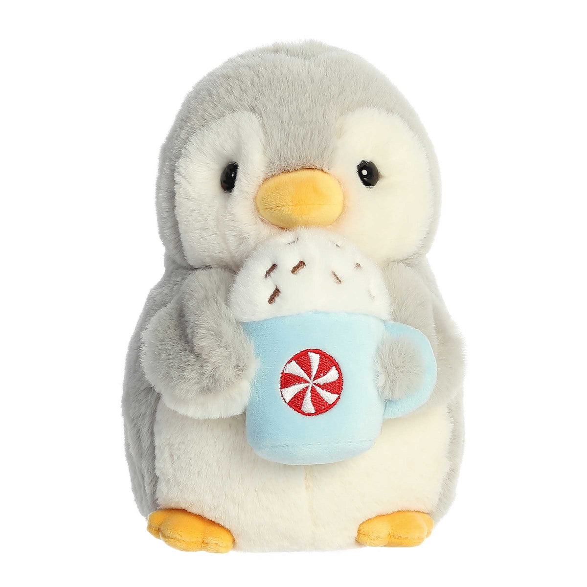 Pompom With Latte plush penguin from Aurora, holding an embroidered latte mug, perfect for cozy holiday decor and cuddles.