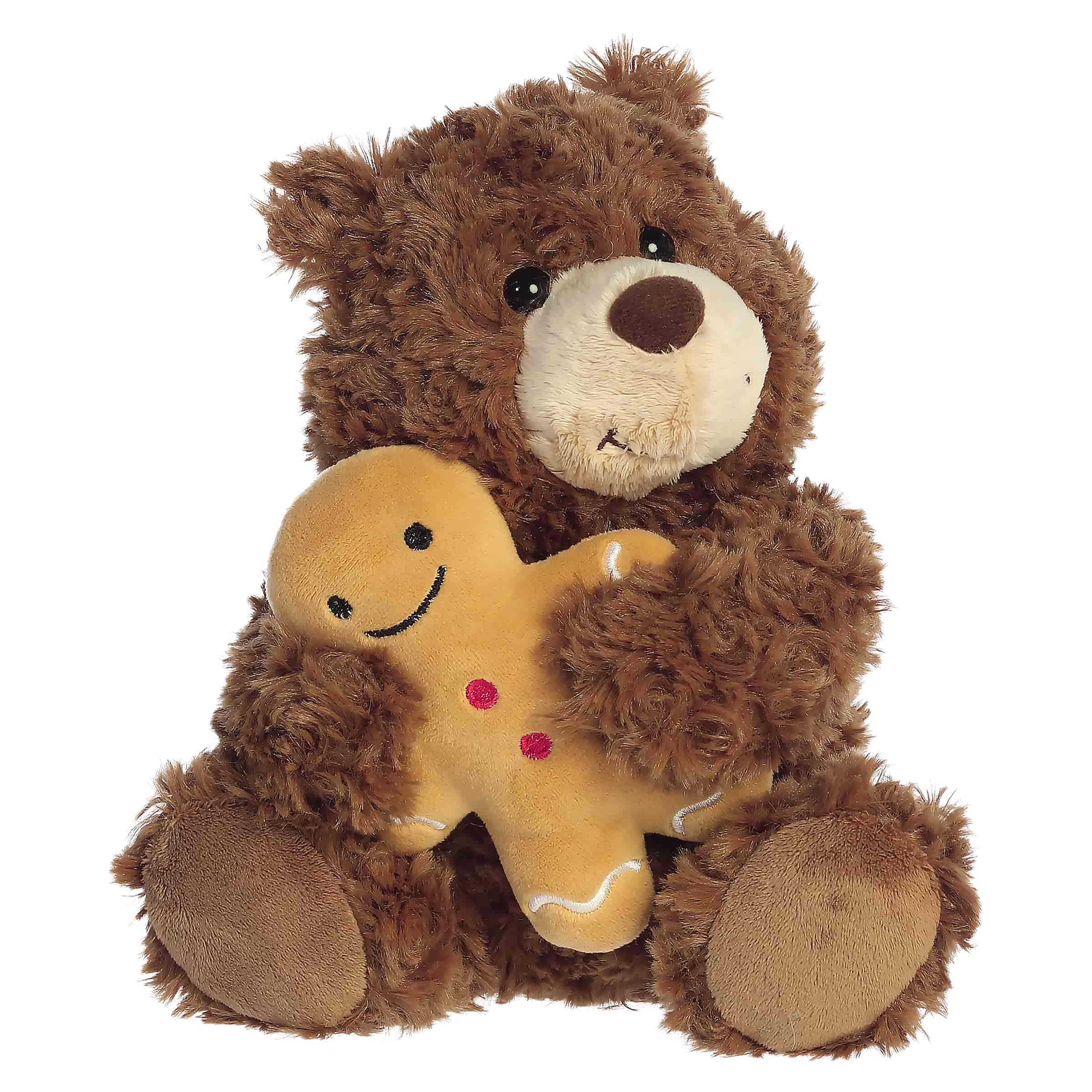 Brown teddy bear plush holding a small gingerbread friend
