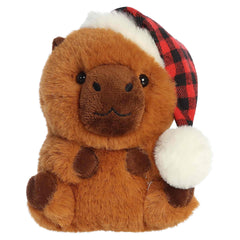 Brown capybara plush wearing a red and white Santa hat