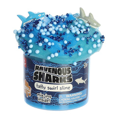 Deep blue Shark Slime from Aurora Toys with exciting shark mix-ins and oceanic beads.