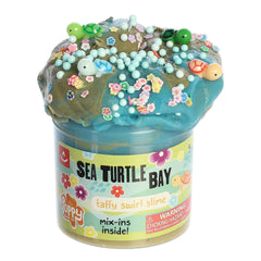 Jar of Sea Turtle Bay Slime by Poppy Slime Co. with ocean-themed mix-ins, including Hawaiian flowers and colorful sea turtles