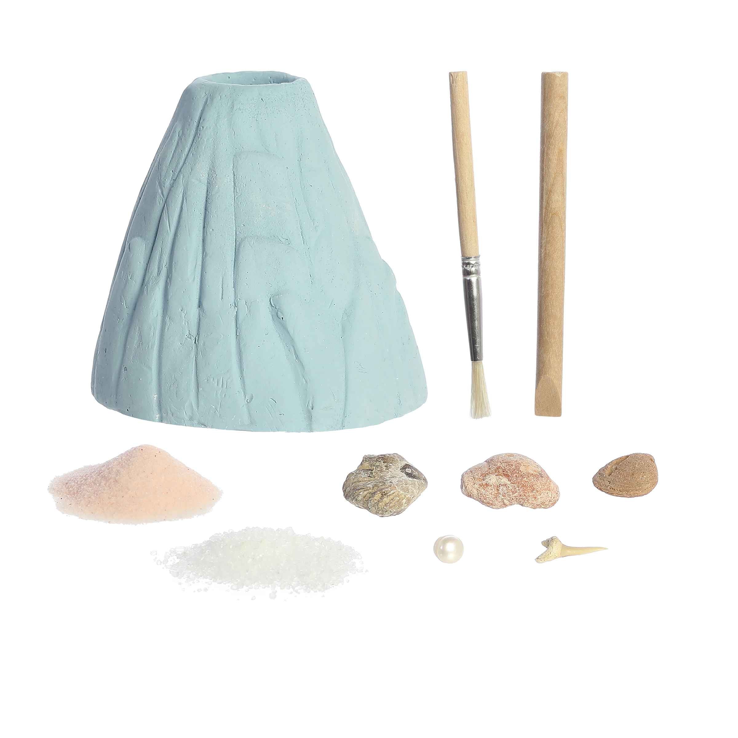 Ocean Fossils Erupt & Dig Volcano kit by Epiphany STEM Labs, featuring a model volcano, digging tools, and sea fossils