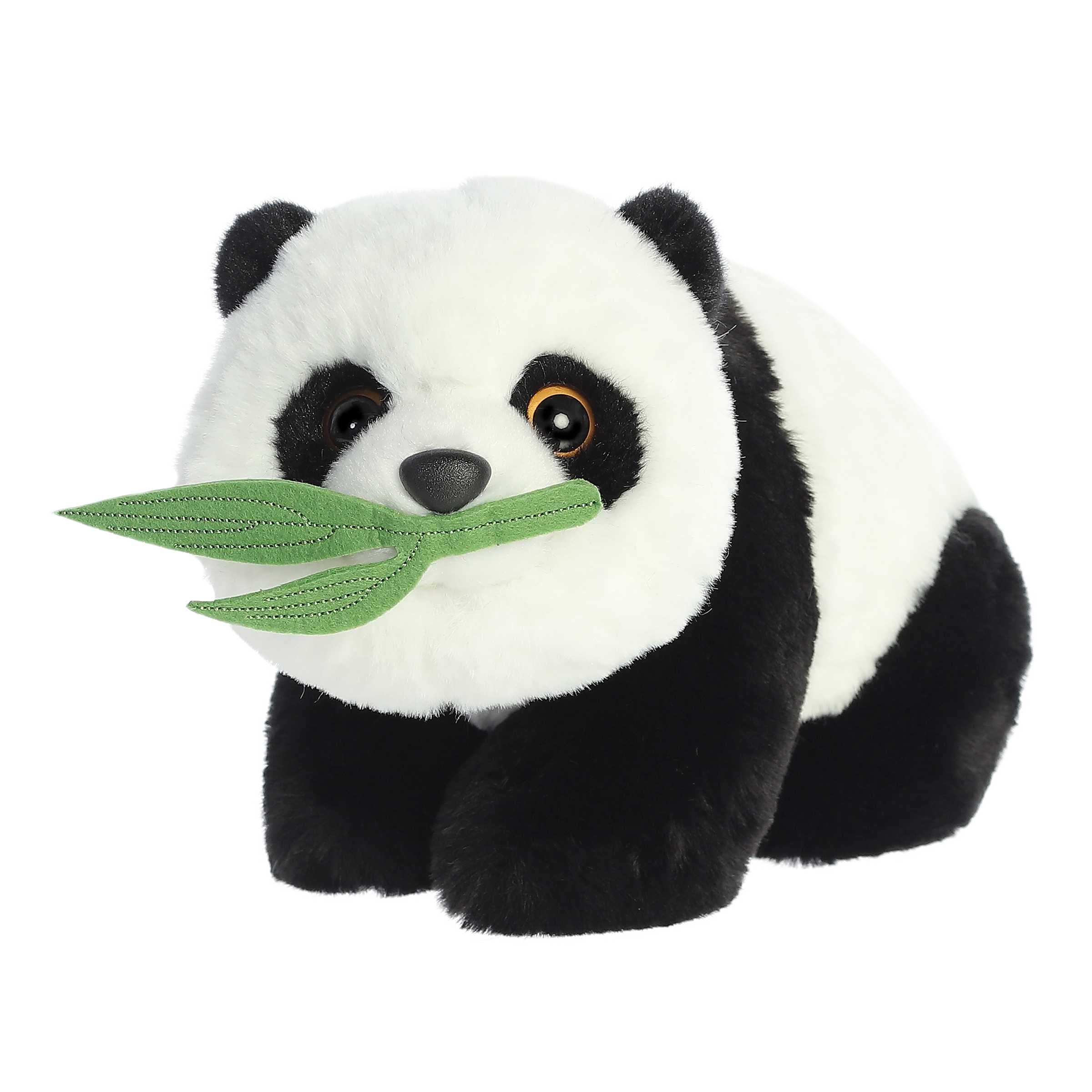 Adorable panda Stuffed animals with black and white soft fur, green leaf attached to its mouth, and black fur around eyes.