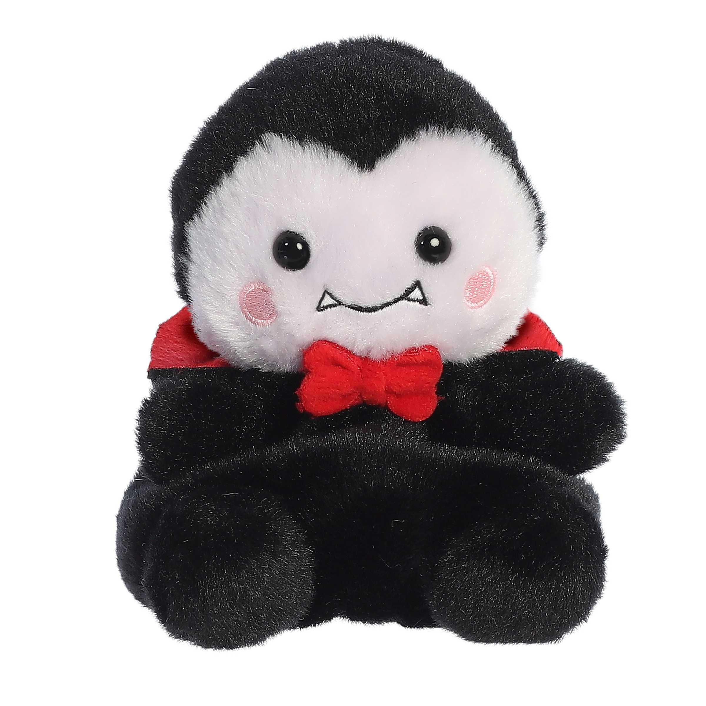 Spooky sitting vampire stuffed animal adorned with a dashing red bow tie, black body, and embroidered fangs