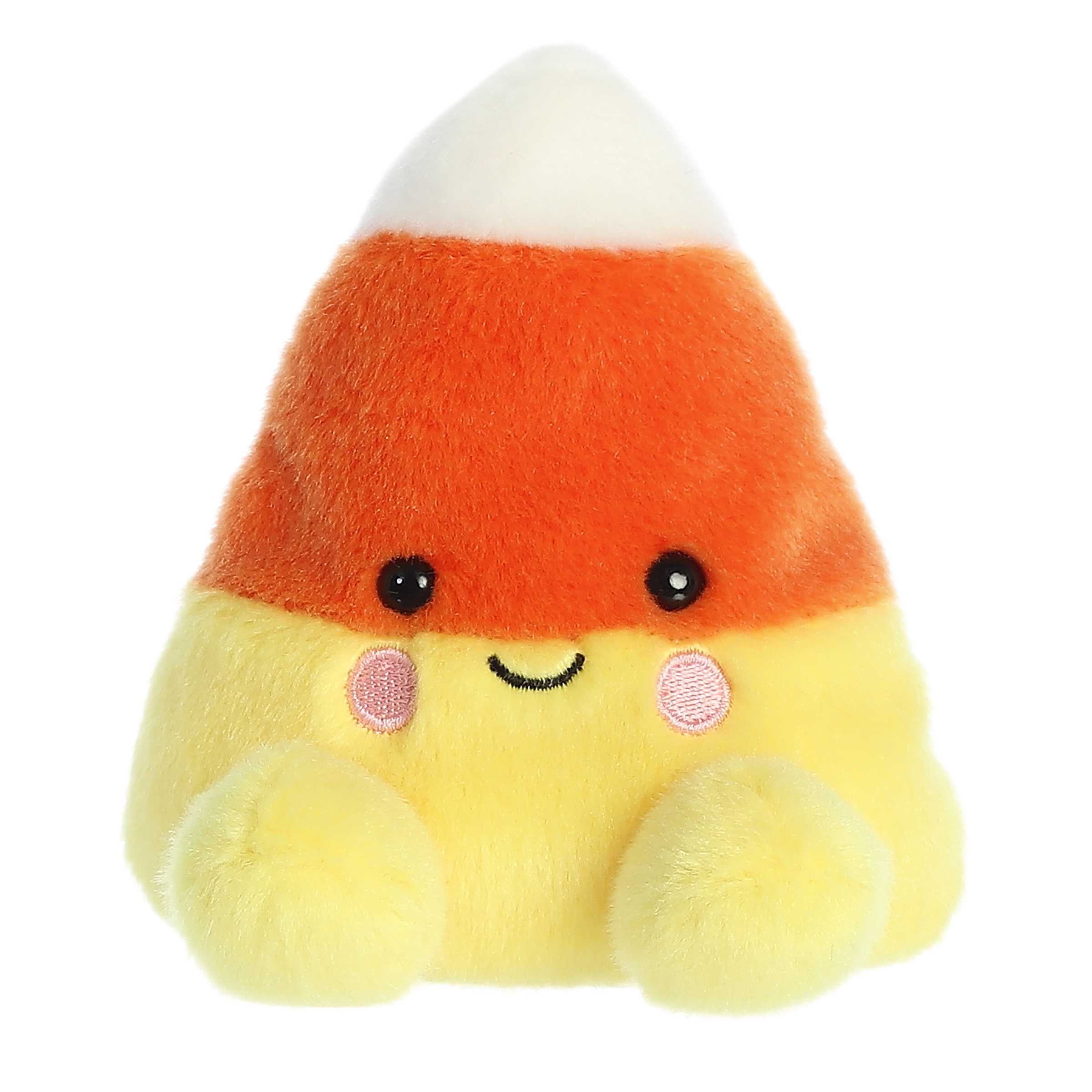 Adorable plushie candy corn treat sitting with a cute smile and blushing pink cheeks