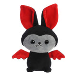 Black bat stuffed animal with striking red ears and tiny wings