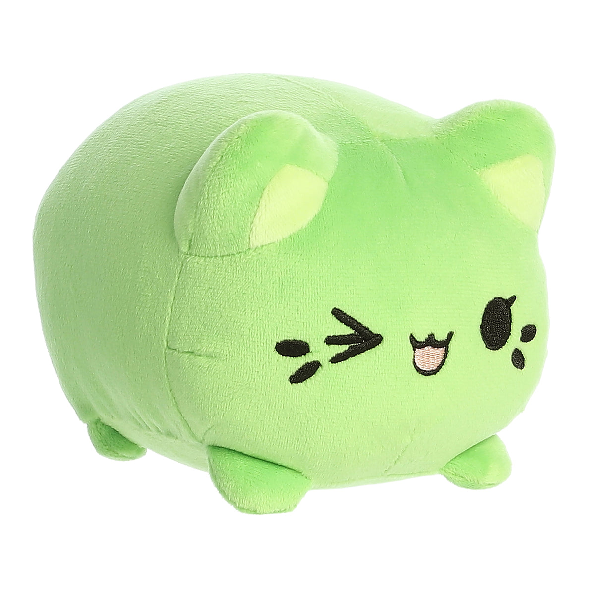 A green Tasty Peach Meowchi plush that is a round cylinder shape with the resemblance of an animated winking cat.