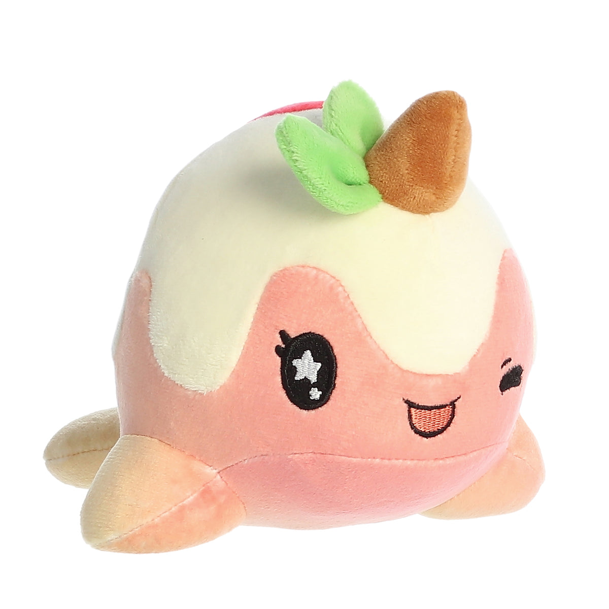 A pink and white Tasty Peach Nomwhal plush that is an expressive narwhal with big sparkling embroidered eyes