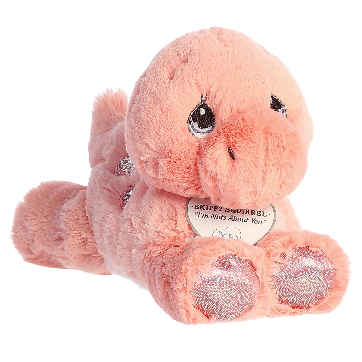 A laying down pink brontosaurus dino plush with tear-drop eyes and an inspirational tag around its neck.