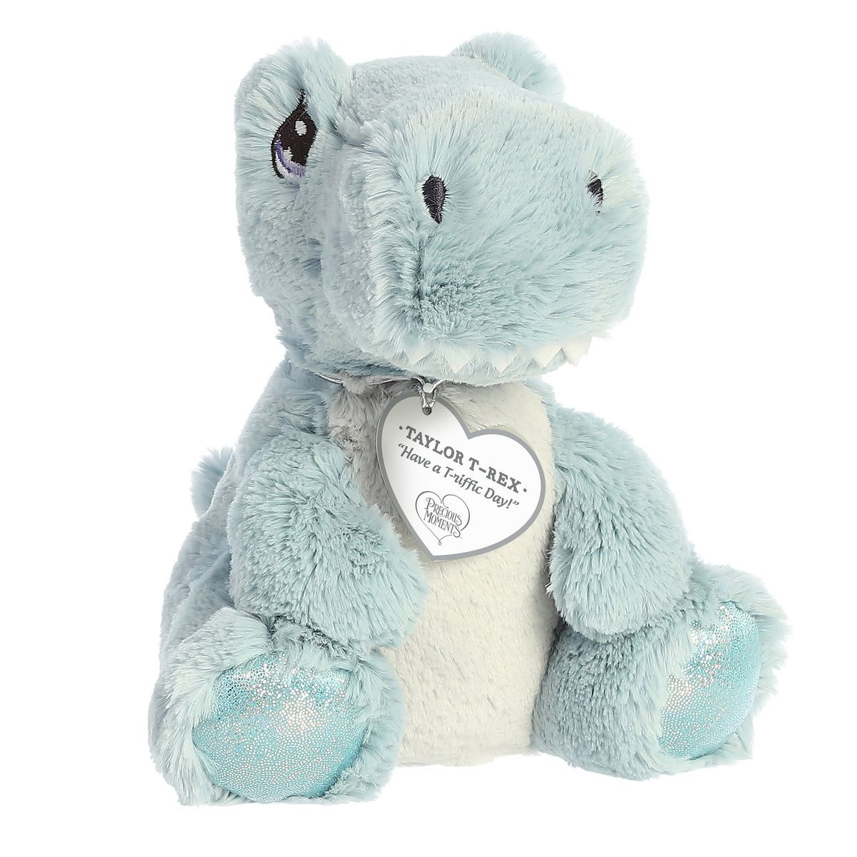 A seated baby blue t-rex dino plush with tear-drop eyes and a precious moments inspirational tag around its neck.