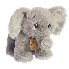 An eco-friendly gray elephant plush with tear-drop eyes, floppy ears, and a precious moments inspirational tag on its neck.