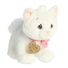 An eco-friendly white kitten plush with tear-drop eyes, pink bow, and a precious moments inspirational tag on its neck.