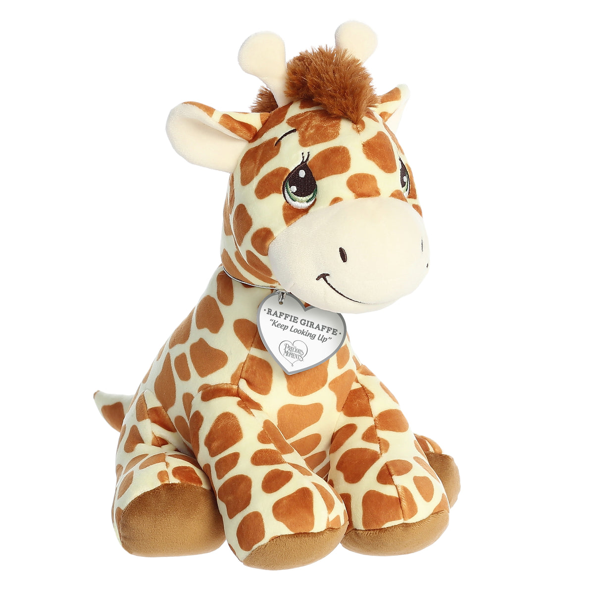 A seated squishy giraffe plush with big teardrop-shaped eyes, a classic giraffe pattern, and an inspirational tag.