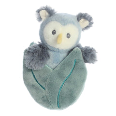 Adorable mini blue owl plush rattle toy with grey fur arms and yellow nose sitting inside a crinkly gray leaf pocket