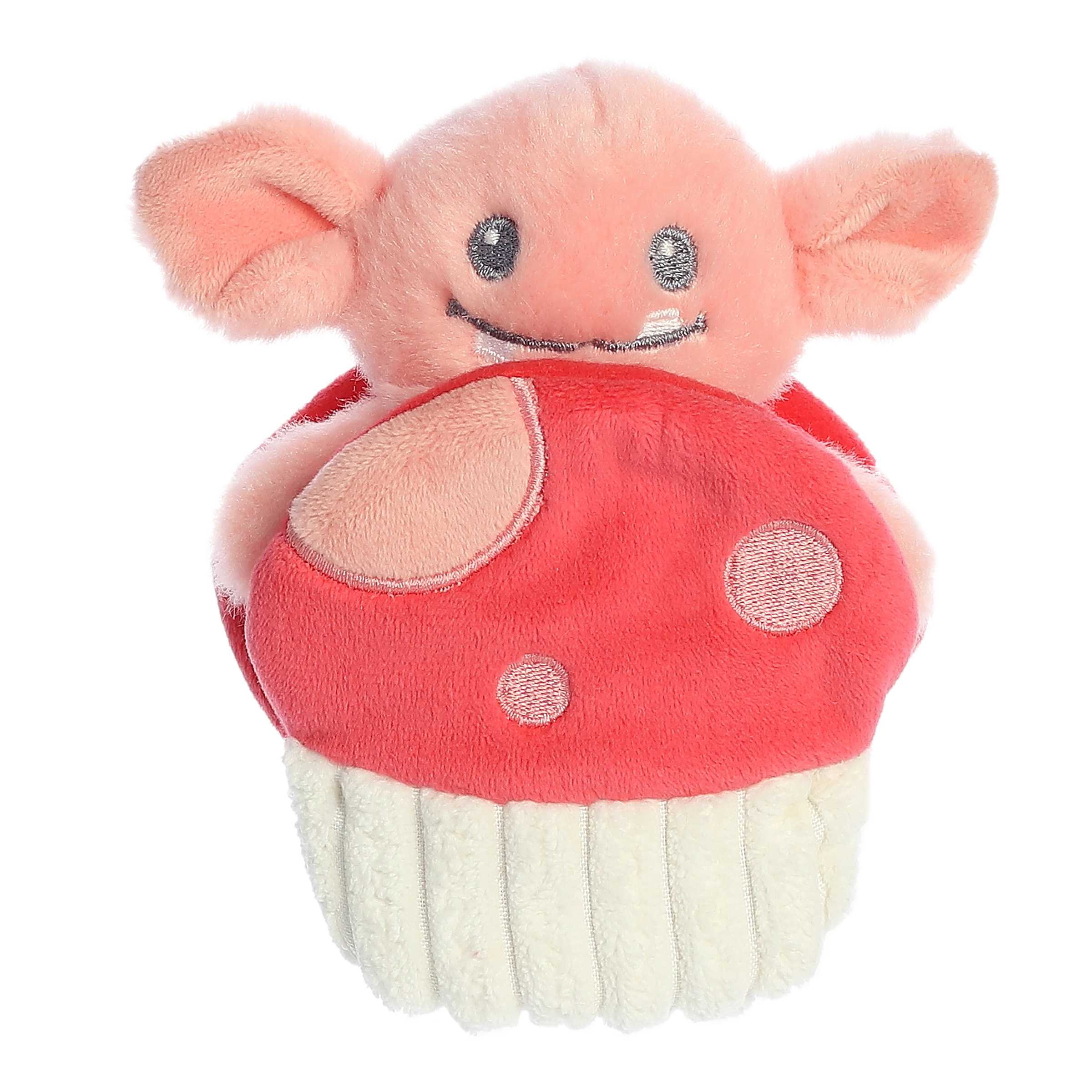 Interactive mini peach Goblin plush rattle toy with smiling face sitting inside a crinkly red and white mushroom pocket