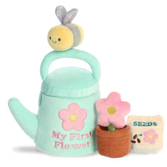 Garden playset with a soft watering can, bee, flower, and crinkling seeds, designed for sensory engagement, by ebba.