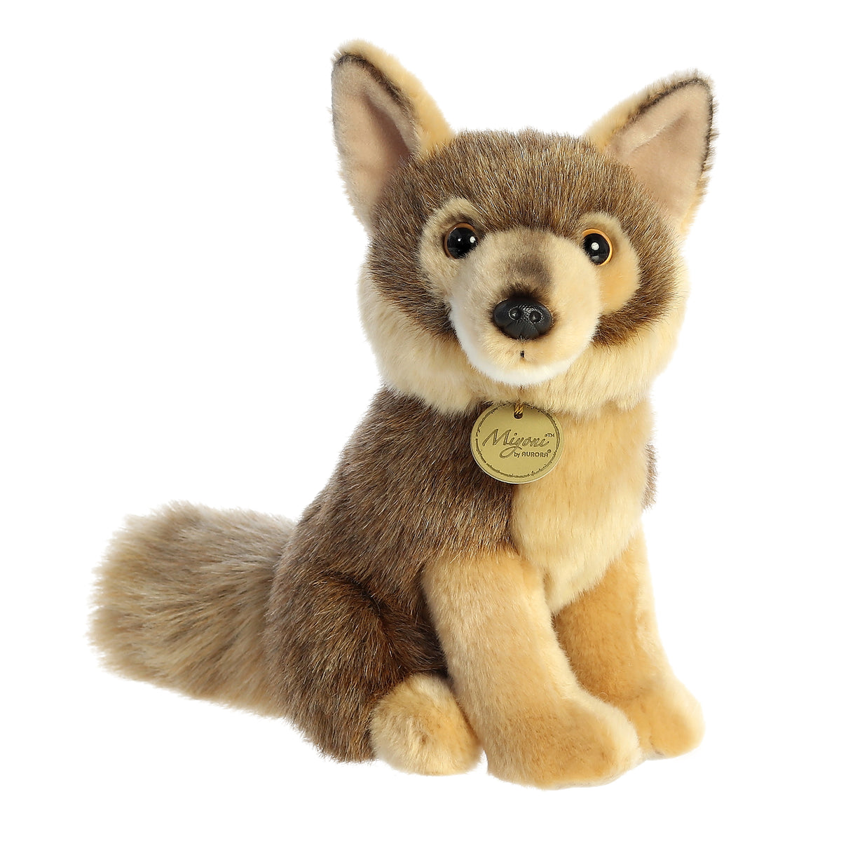 Coyote stuffed animal with a light brown body, dark brown shading, and pointed ears, in the seated position with a hang tag.