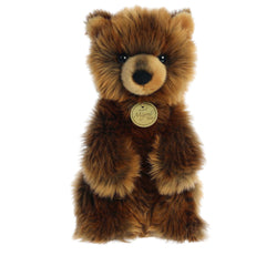Lifelike Grizzly Bear Cub plush with rich brown fur and expressive eyes, crafted for realism and cuddles, by Aurora.