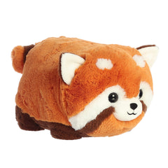 Remy Red Panda plush with a vibrant orange hue, showcasing the Spudsters potato-shaped body and whimsical facial details.