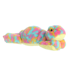 Snoozles Gecko plush lying flat, showcasing its vibrant pink, blue, and yellow coat with a soft light yellow underbelly.