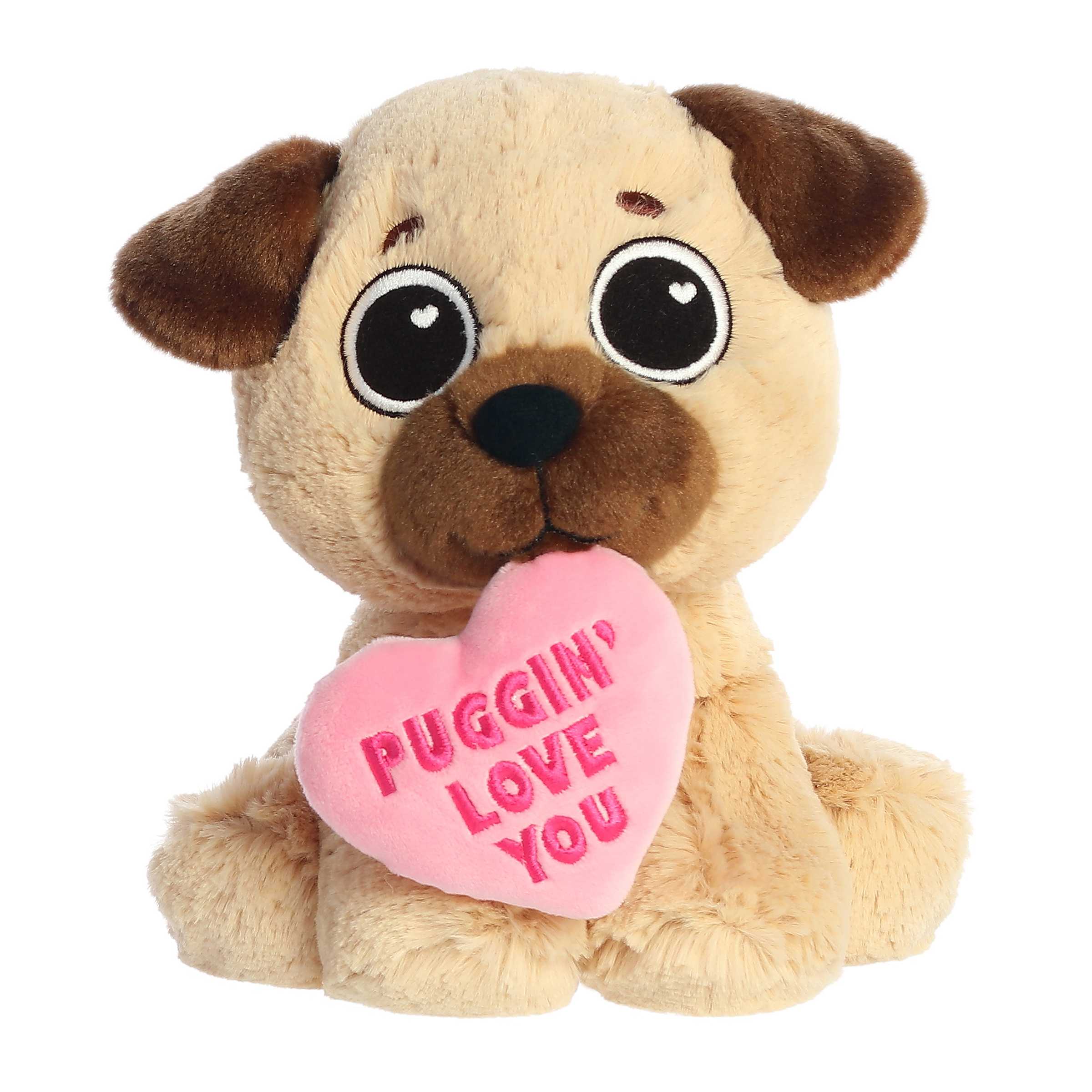 Adorable pug plush toy with a tan and brown body, holds a pink heart on its mouth with "Puggin' Love You" pun written across