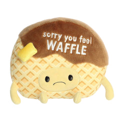 Adorable waffle plush toy with a light brown waffle and dark brown syrup body, and "sorry you feel waffle" pun written across