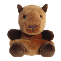 A tiny cute capybara plush with soft brown fur and a dark brown embroidered nose, and with chocolate-colored ears and paws